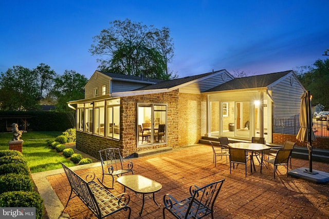 8610 Westmeath Ct, Springfield, VA 22152 - rear view of property with a patio, outdoor dining area, fence, and brick siding