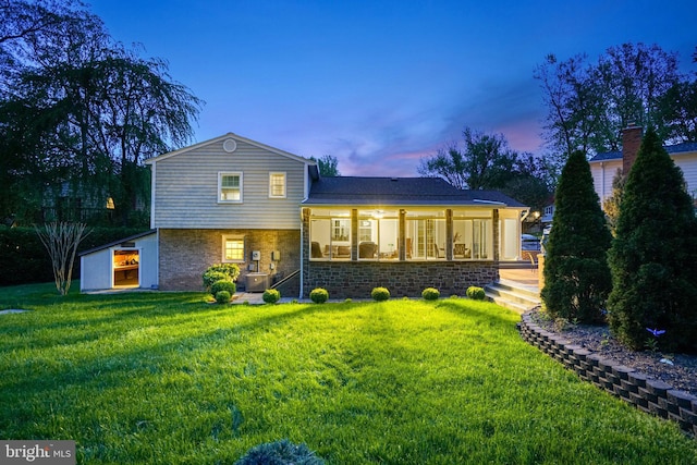 8610 Westmeath Ct, Springfield, VA 22152 - back of house featuring a lawn and stone siding