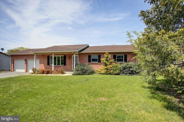 ranch-style home featuring a garage, concrete driveway, and brick siding