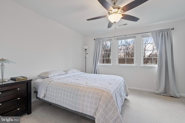 bedroom featuring visible vents, carpet flooring, baseboards, and ceiling fan