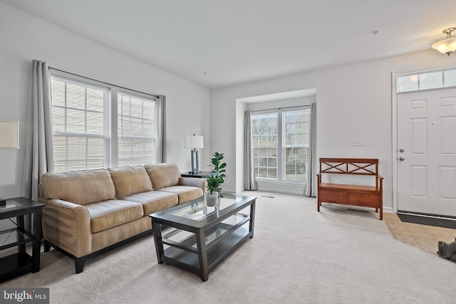 living area featuring light colored carpet