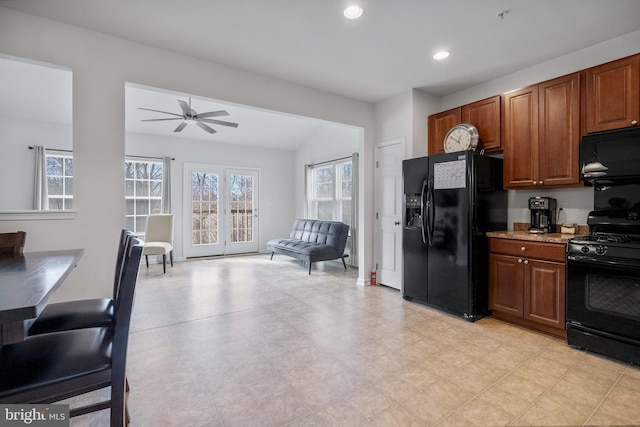 kitchen with brown cabinets, a ceiling fan, recessed lighting, light floors, and black appliances