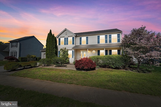 traditional home with a yard