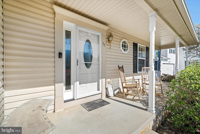 property entrance featuring covered porch