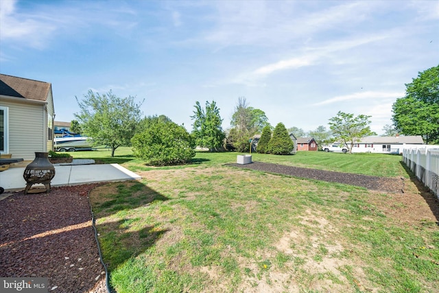 view of yard featuring fence and a patio area