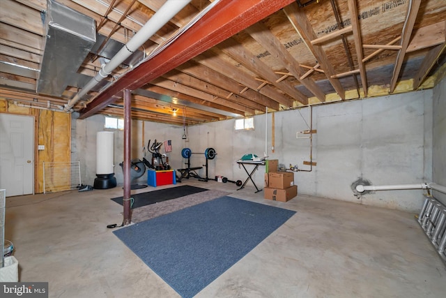 exercise room featuring gas water heater