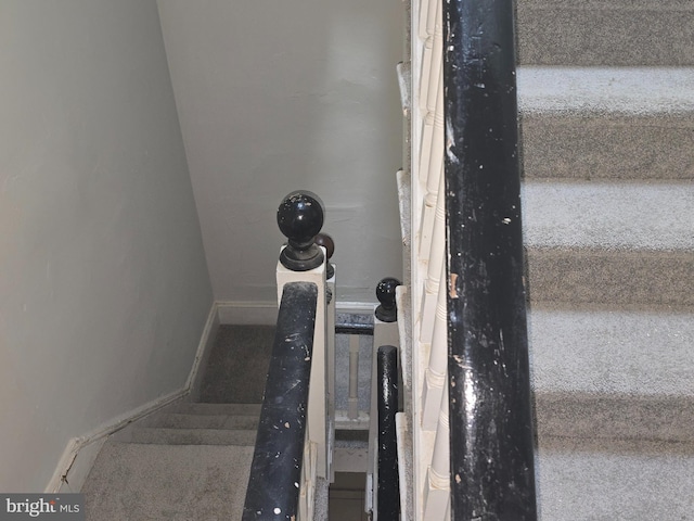 stairs featuring baseboards
