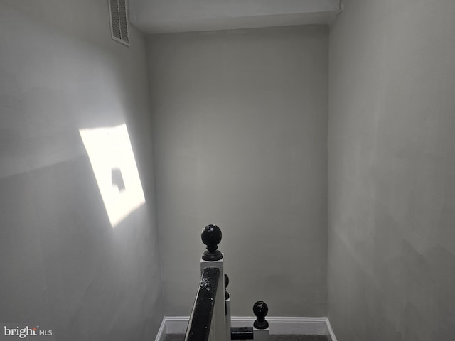 interior space with baseboards and visible vents