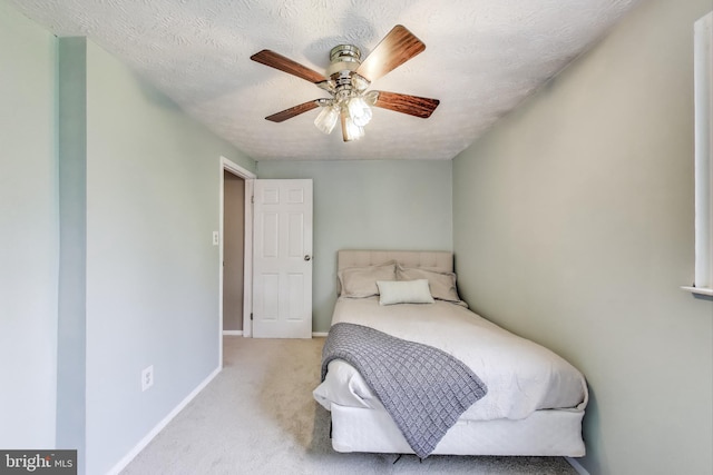 bedroom featuring carpet floors, baseboards, and ceiling fan