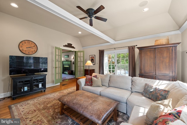 living area with ceiling fan, vaulted ceiling, recessed lighting, and wood finished floors