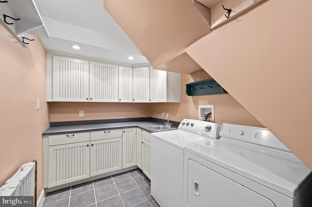 laundry room featuring laundry area, radiator, washer and dryer, recessed lighting, and a sink