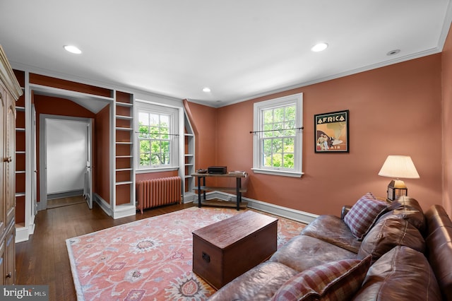 living room featuring crown molding, radiator, wood finished floors, baseboards, and recessed lighting