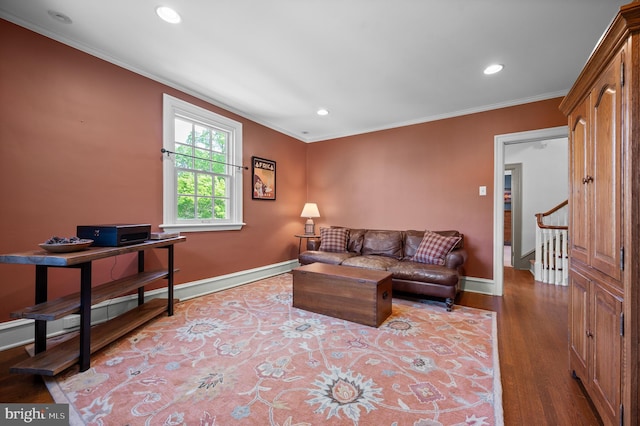 living area featuring crown molding, stairs, recessed lighting, baseboards, and wood finished floors