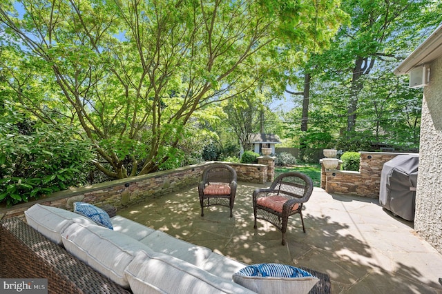 view of patio featuring an outdoor living space and grilling area