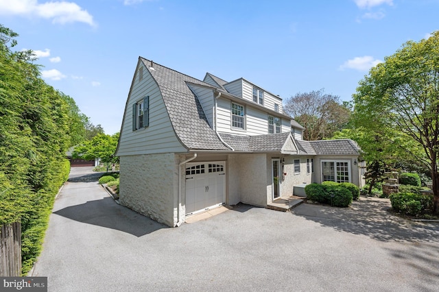 view of front of property with driveway and a garage
