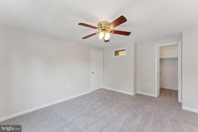 4411 Pembrook Village Dr Unit 101, Alexandria, VA 22309 - unfurnished bedroom featuring baseboards, a ceiling fan, carpet, and a walk in closet