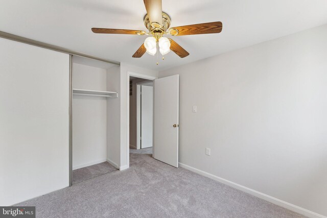 4411 Pembrook Village Dr Unit 101, Alexandria, VA 22309 - unfurnished bedroom featuring baseboards, ceiling fan, a closet, and light colored carpet