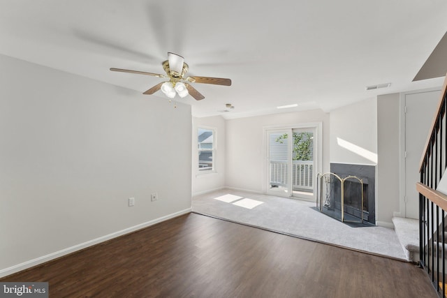 4411 Pembrook Village Dr Unit 101, Alexandria, VA 22309 - unfurnished living room featuring ceiling fan, a fireplace with flush hearth, wood finished floors, stairway, and baseboards