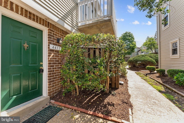 4411 Pembrook Village Dr Unit 101, Alexandria, VA 22309 - property entrance with brick siding and a balcony