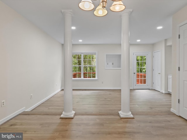 109 Donelson Loop, Stafford, VA 22554 - entryway featuring recessed lighting, baseboards, ornate columns, wood finished floors, and a chandelier