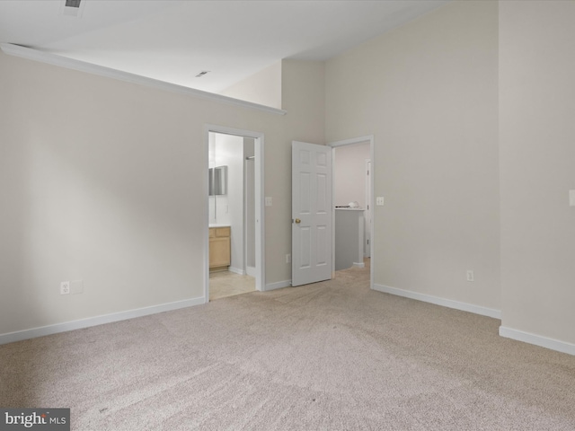 109 Donelson Loop, Stafford, VA 22554 - unfurnished bedroom with light colored carpet, high vaulted ceiling, baseboards, and ensuite bathroom