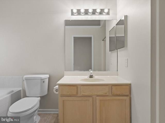 109 Donelson Loop, Stafford, VA 22554 - bathroom with toilet, tiled bath, vanity, baseboards, and tile patterned floors