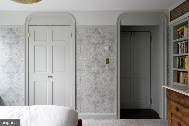 bedroom featuring wallpapered walls
