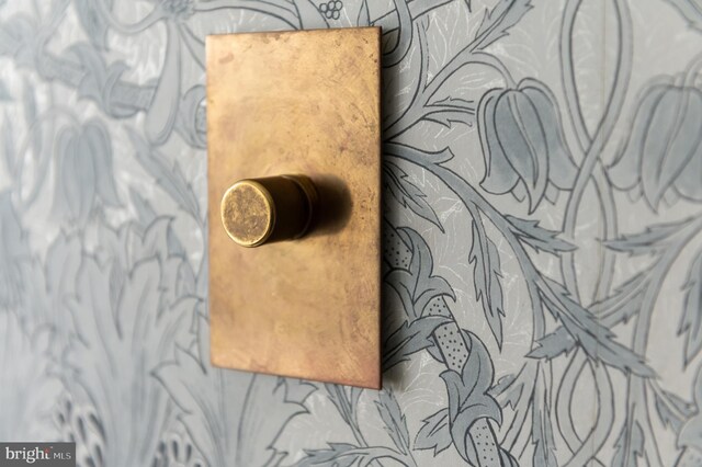 interior details featuring wallpapered walls