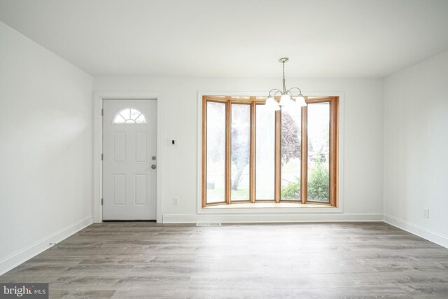 505 University Blvd, Wenonah, NJ 08090 - foyer featuring a chandelier, wood finished floors, and baseboards