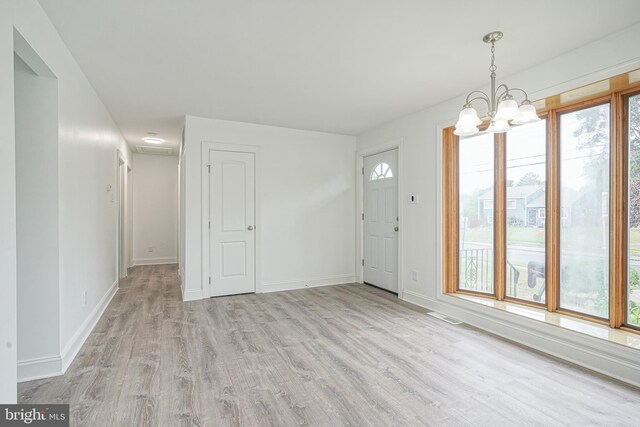 505 University Blvd, Wenonah, NJ 08090 - unfurnished dining area with wood finished floors, a chandelier, and baseboards