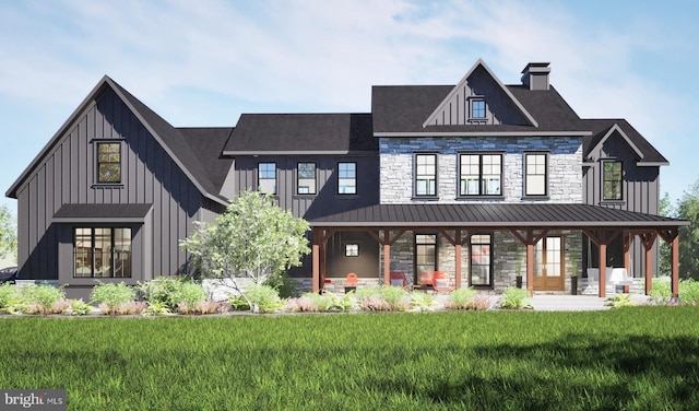 457 Brownsburg Rd W, Unit W, Newtown, PA 18940 - exterior space with a lawn, a standing seam roof, and board and batten siding