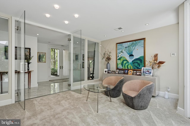 sitting room with french doors, visible vents, baseboards, carpet flooring, and recessed lighting