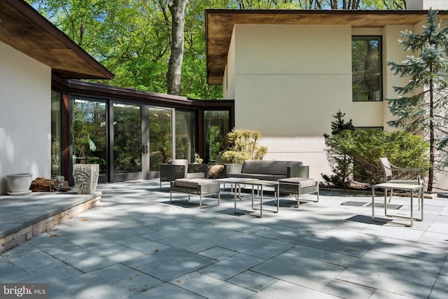 view of patio / terrace featuring french doors and an outdoor living space