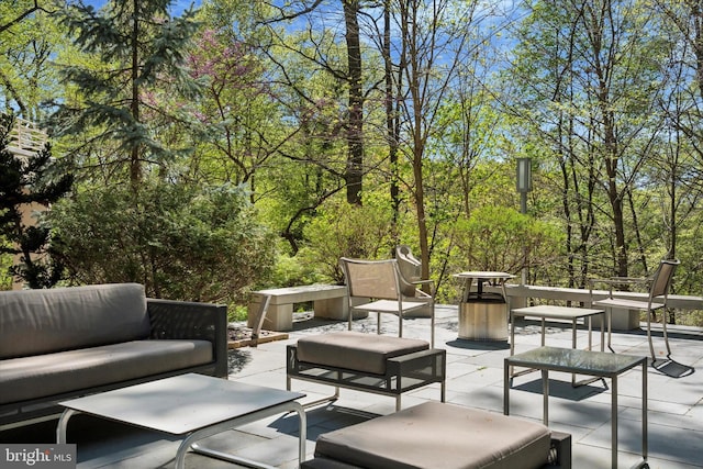 deck featuring outdoor lounge area and a patio area