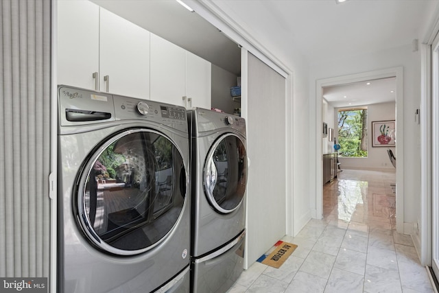 laundry room with cabinet space, washer and dryer, marble finish floor, recessed lighting, and baseboards