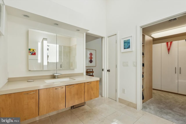bathroom with vanity, tile patterned floors, and visible vents