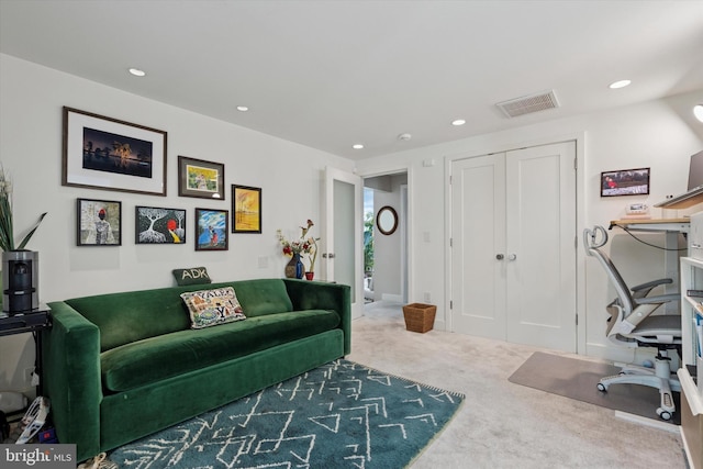 carpeted living room featuring recessed lighting and visible vents