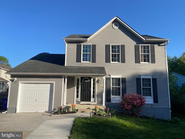 view of front of house with driveway and a garage
