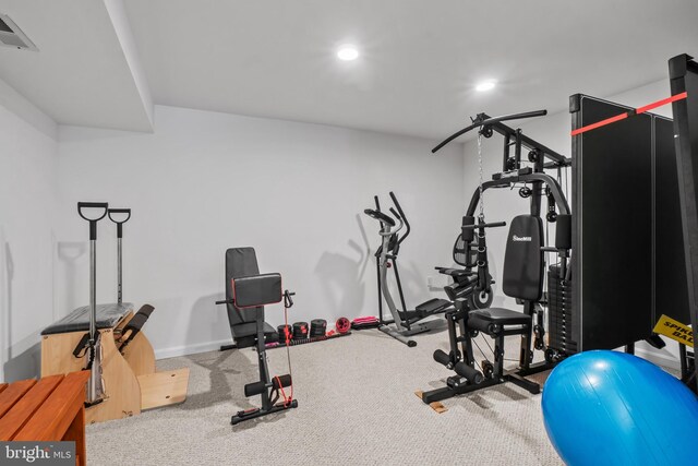 exercise room featuring recessed lighting, baseboards, and carpet