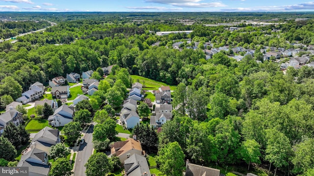 aerial view of residential area with a forest