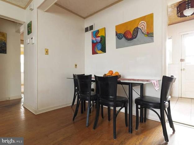 4627 Central Ave NE, Washington, DC 20019 - dining room with visible vents, baseboards, and wood finished floors