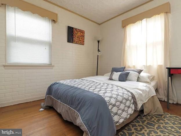 4627 Central Ave NE, Washington, DC 20019 - bedroom with crown molding and wood finished floors