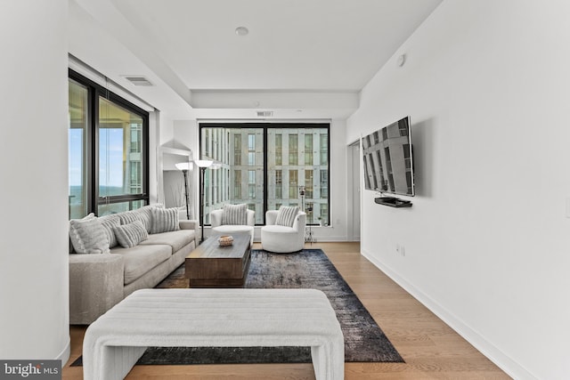 1650 Silver Hill Dr Unit 1706, Mclean, VA 22102 - living room featuring baseboards, visible vents, and wood finished floors