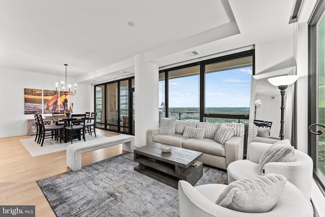 1650 Silver Hill Dr Unit 1706, Mclean, VA 22102 - living room featuring visible vents, an inviting chandelier, and wood finished floors