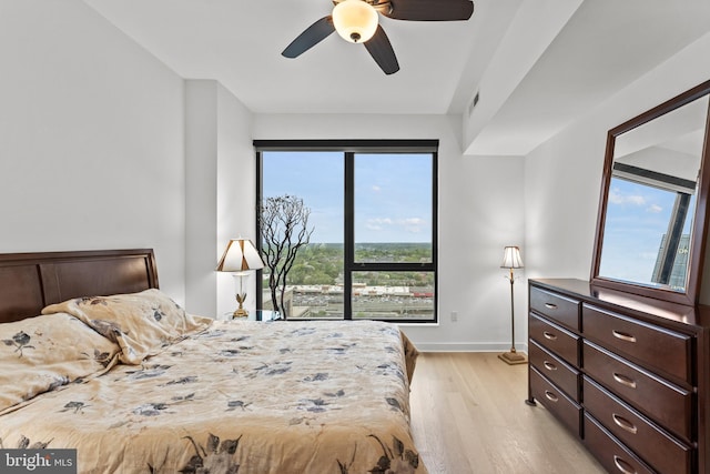 1650 Silver Hill Dr Unit 1706, Mclean, VA 22102 - bedroom featuring baseboards, ceiling fan, and light wood-type flooring