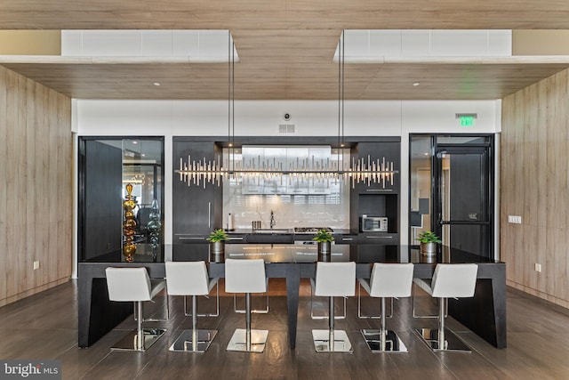 1650 Silver Hill Dr Unit 1706, Mclean, VA 22102 - bar with indoor wet bar, wooden walls, and a sink