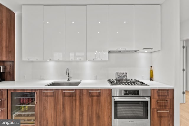 1650 Silver Hill Dr Unit 1706, Mclean, VA 22102 - kitchen featuring stainless steel appliances, a sink, white cabinetry, and modern cabinets