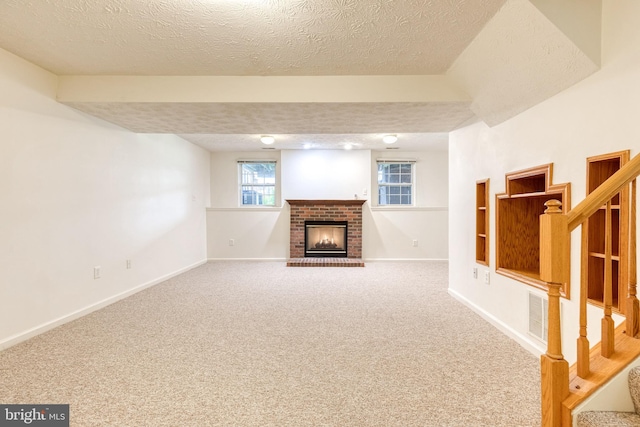 7 Silver Birch Ct, Owings Mills, MD 21117 - basement featuring a brick fireplace, a textured ceiling, stairs, and carpet floors
