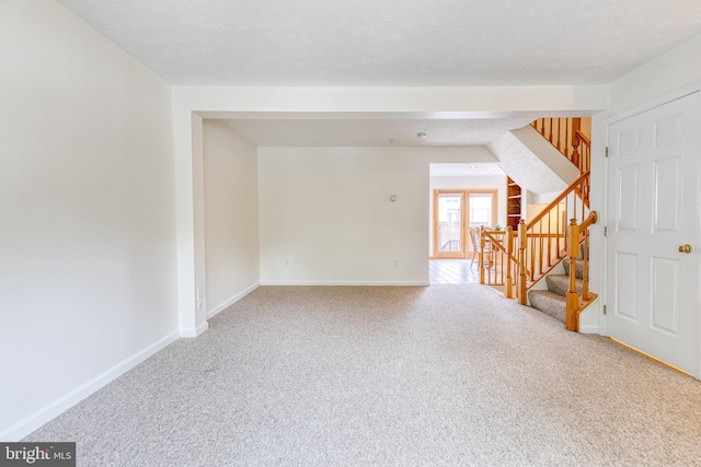 7 Silver Birch Ct, Owings Mills, MD 21117 - unfurnished room with carpet floors, stairs, and a textured ceiling
