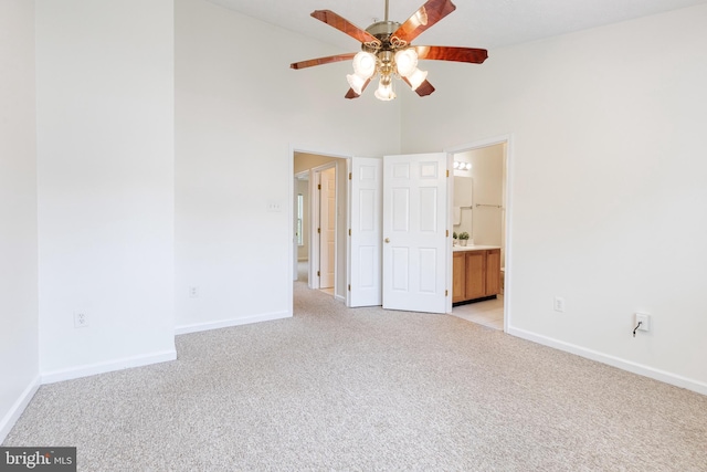 7 Silver Birch Ct, Owings Mills, MD 21117 - spare room featuring light colored carpet, ceiling fan, and a towering ceiling